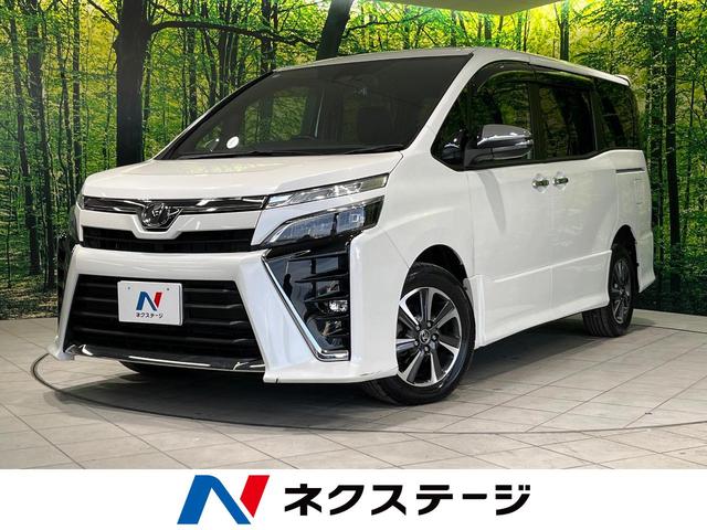 ヴォクシー(トヨタ) ＺＳ　煌　４ＷＤ　純正１０型ナビ　衝突軽減　両側電動ドア　リアオートエアコン　クルコン　Ｂｌｕｅｔｏｏｔｈ　フルセグ　バックカメラ　ＬＥＤヘッド　８人乗り　オートハイビーム　車線逸脱警報　ドラレコ　ＥＴＣ 中古車画像