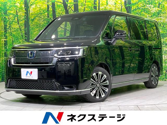 ステップワゴン(ホンダ) ｅ：ＨＥＶスパーダ　プレミアムライン　両側電動スライドドア　純正１１型ナビ　全周囲カメラ　衝突被害軽減システム　禁煙車　電動リアゲート　シートヒーター　ハーフレザーシート　ドラレコ　コーナーセンサー　ＬＥＤヘッド　ビルトインＥＴＣ 中古車画像