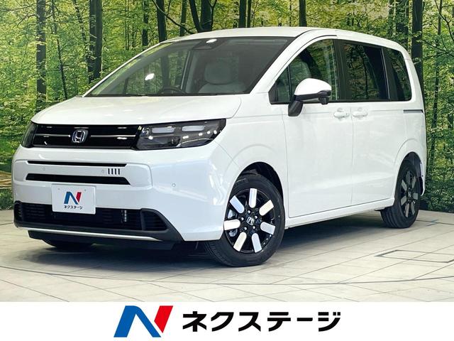 フリード(ホンダ) ｅ：ＨＥＶエアー　ＥＸ　登録済未使用車　両側電動ドア　ホンダセンシング　アダプティブクルーズ　ハーフレザーシート 中古車画像