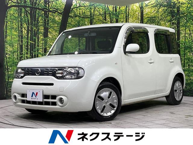キューブ(日産) １５Ｘ　ＦＯＵＲ　インディゴ＋プラズマ　４ＷＤ　禁煙車　ＳＤナビ　スマートキー　オートエアコン　電動格納ミラー　ＨＩＤヘッドランプ　革巻きステアリングホイール　インテリジェントエアコンシステム　　インディゴブルースエード調クロスシート 中古車画像