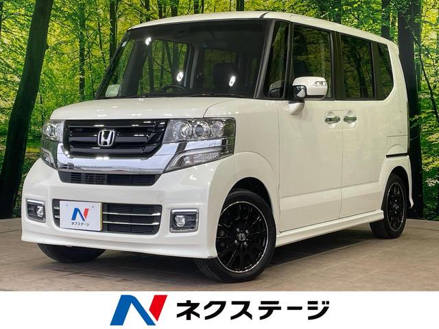 Ｎ−ＢＯＸカスタム(ホンダ) Ｇ　ターボＳＳブラックスタイルパッケージ　１年保証付　両側電動ドア　純正ナビ　バックカメラ　衝突被害軽減システム　禁煙車　ハーフレザーシート　スマートキー　ＨＩＤヘッド　ＥＴＣ　クルコン　純正１５インチアルミ　オートライト　オートエアコン 中古車画像