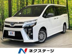 ヴォクシー ハイブリッドZS 煌III 両側電動ドア 純正9型ナビ 後席モニター バックカメラ 衝突被害軽減システム 禁煙車 ハーフレザーシート ドラレコ コーナーセンサー スマートキー LEDヘッド ビルトインETC クルコン 中古車画像