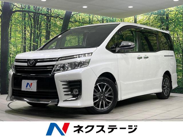 ヴォクシー(トヨタ) ＺＳ　煌　純正９型ナビ　両側パワースライドドア　バックカメラ　ＣＤ／ＤＶＤ／フルセグ　Ｂｌｕｅｔｏｏｔｈ　ＬＥＤランプ　フロントフォグ　オートライト　デュアルエアコン　スマートキー　アイドリングストップ 中古車画像
