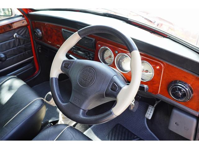 MINI 4MT・ワンオーナー車・フルオリジナル・コンビハンドル・ウッドパネル・ブラックレザーシート・禁煙車・最終モデル・12インチアルミホイール・エアコン・保証付き・ディーラー車・運転席エアバッグ(5枚目)