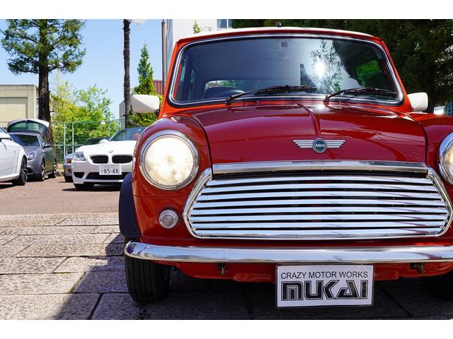 MINI 4MT・ワンオーナー車・フルオリジナル・コンビハンドル・ウッドパネル・ブラックレザーシート・禁煙車・最終モデル・12インチアルミホイール・エアコン・保証付き・ディーラー車・運転席エアバッグ(14枚目)