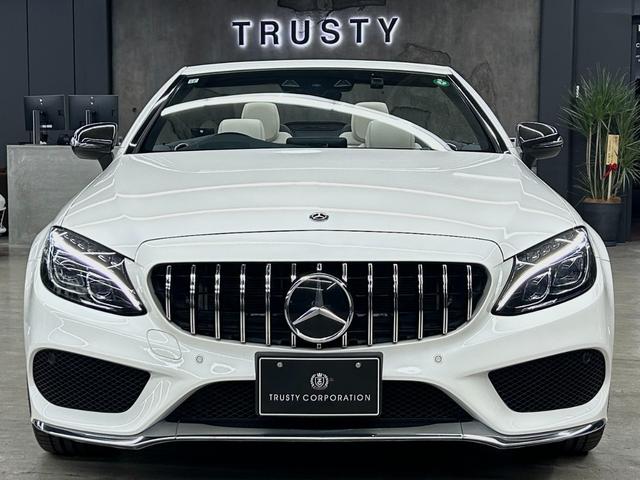 Cクラス C180カブリオレスポーツ ホワイトレザー 青幌 43仕様 S.D.Fマフラー レザーエクスクルーシブPKG レッドキャリパー ディクセル低ダストパッド パナメリカーナグリル トランクスポイラー カーボン調ミラーカバー(8枚目)