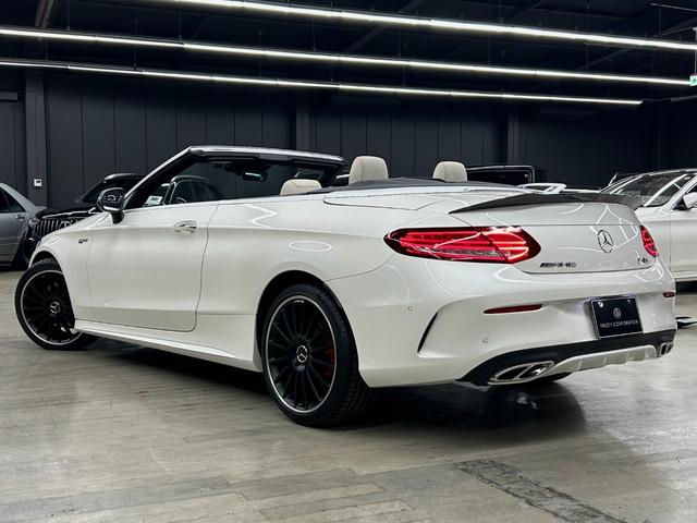 Cクラス C180カブリオレスポーツ ホワイトレザー 青幌 43仕様 S.D.Fマフラー レザーエクスクルーシブPKG レッドキャリパー ディクセル低ダストパッド パナメリカーナグリル トランクスポイラー カーボン調ミラーカバー(12枚目)