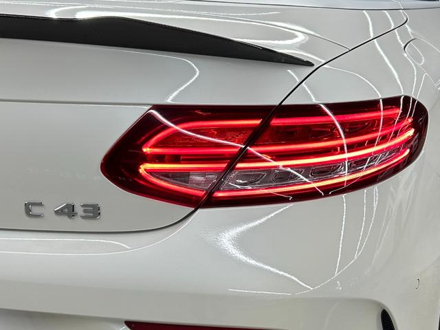 Cクラス C180カブリオレスポーツ ホワイトレザー 青幌 43仕様 S.D.Fマフラー レザーエクスクルーシブPKG レッドキャリパー ディクセル低ダストパッド パナメリカーナグリル トランクスポイラー カーボン調ミラーカバー(25枚目)