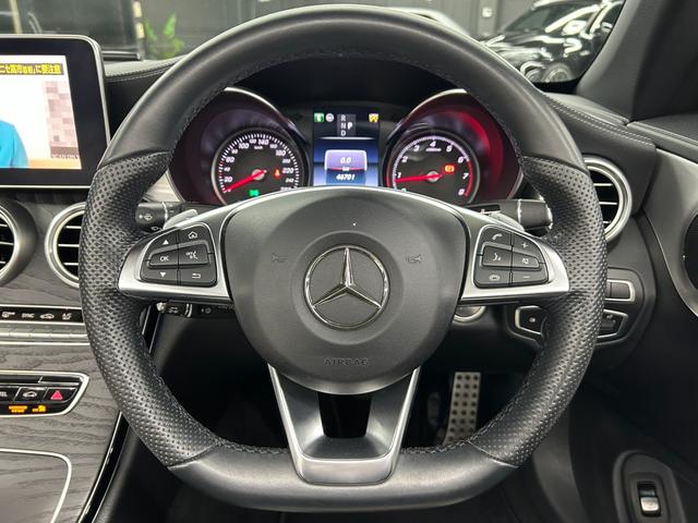 Cクラス C180カブリオレスポーツ ホワイトレザー 青幌 43仕様 S.D.Fマフラー レザーエクスクルーシブPKG レッドキャリパー ディクセル低ダストパッド パナメリカーナグリル トランクスポイラー カーボン調ミラーカバー(26枚目)