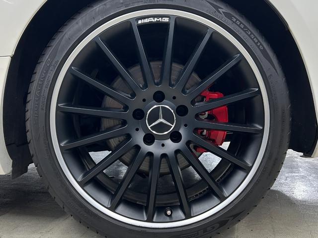 Cクラス C180カブリオレスポーツ ホワイトレザー 青幌 43仕様 S.D.Fマフラー レザーエクスクルーシブPKG レッドキャリパー ディクセル低ダストパッド パナメリカーナグリル トランクスポイラー カーボン調ミラーカバー(53枚目)