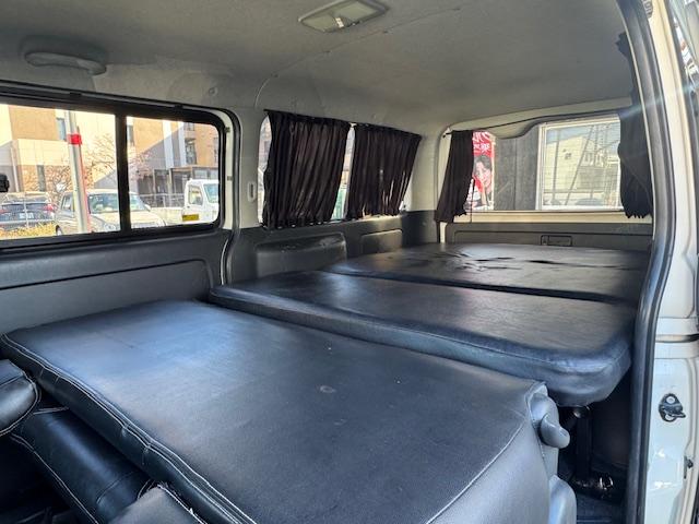 ハイエースバン ロングスーパーGL HIDライト LEDフォグ 社外テール ローダウン15インチAW ALPINEナビ地デジフルセグTV ALPINE天井モニター バックカメラETC ベッドキット シートカバー 黒木目オーディオパネル(75枚目)