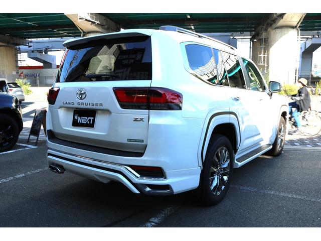 ランドクルーザー ZX ワンオーナー モデリスタエアロ Rエンターテイメント JBL クールボックス 寒冷地仕様 電動Rデフロック 空気圧警報 ブラックルーフレール ベージュ革シート(7枚目)