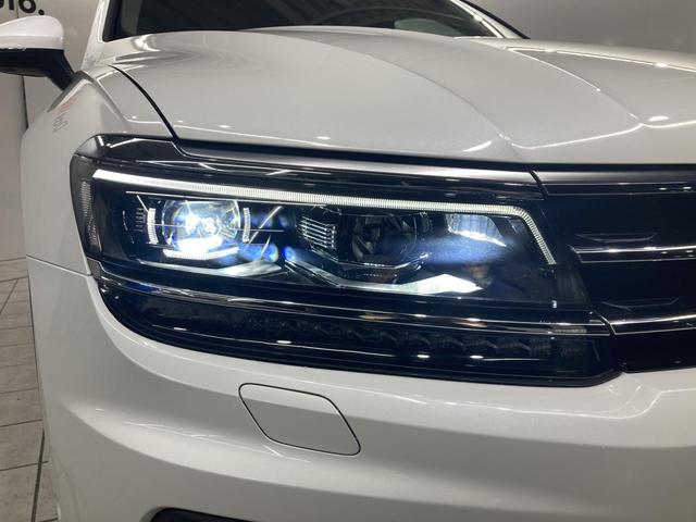 ティグアン ディナウディオエディション 特別仕様車 レザーシート シートヒーター パドルシフト 電動パーキングブレーキ アラウンドビューカメラ 純正ナビ 19インチアルミ レーンアシスト パワーシート 電動リアゲート シルバールーフレール(27枚目)