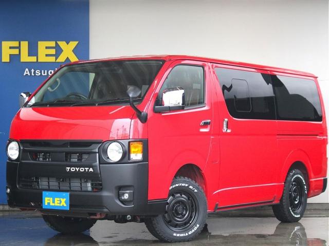 ロングスーパーGL 丸目フェイスチェンジ 丸目キット TOYOTAマーク マットブラック塗装 アルミホイール オープンカントリータイヤ 寒冷地仕様 デジタルインナーミラー パノラミックビューモニター レッド シートカバー(1枚目)