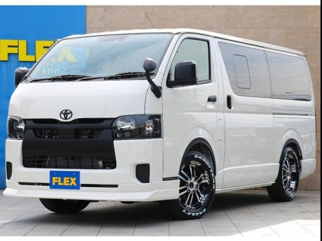 ハイエースバン(トヨタ) ロングDX GLパッケージ GLパッケージ!ディーゼルターボ4WD ホワイト ヘッドライトブラック塗装 オリジナルフロントスポイラー デルフ02 17インチアルミ オーバーフェンダー 各所ブラック施工 カロッツェリアナビ 中古車画像