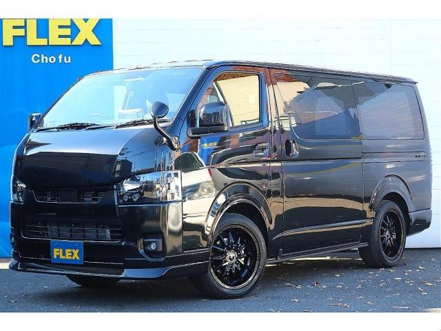 ハイエースバン(トヨタ) スーパーＧＬ　ダークプライムＩＩ　アルパイン　ＢＩＧ−Ｘ１１インチナビメカレスＥＴＣ２．０ベッドキットＦＬＥＸボンネットフロントスポイラーオーバーフェンダーＬＥＤテールＦＬＥＸ１８インチアルミヨコハマタイヤメッキ部ブラック塗装 中古車画像