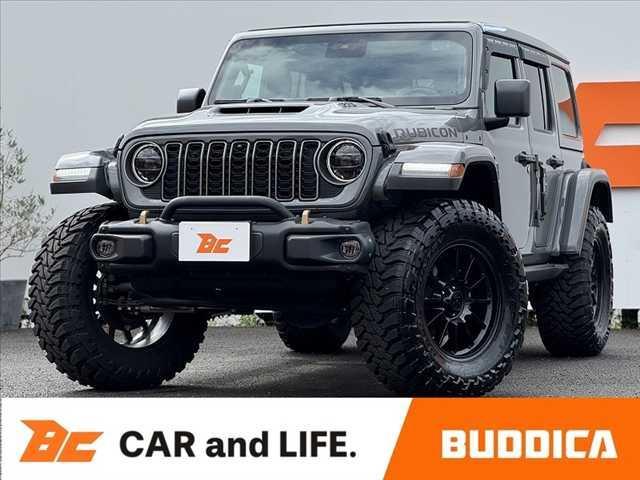 ジープ・ラングラーアンリミテッド(ジープ) 　禁煙車　４ＷＤ　左Ｈ　可変付４本出しマフラー　３７インチタイヤ　スカイワンタッチパワートップ　本革シート　電動サイドステップ　Ｂカメラ　アダプティブクルコン　ドラレコ　ＥＴＣ　背面タイヤ　ＬＥＤヘッド 中古車画像