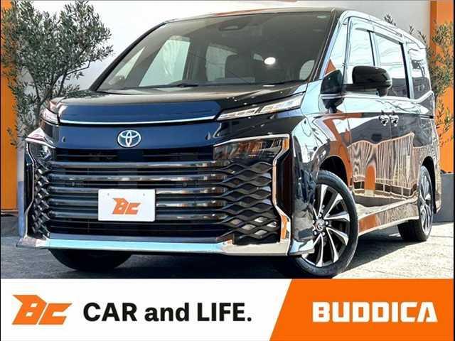 ヴォクシー(トヨタ) ハイブリッドＳ−Ｚ　禁煙　ディスプレイオーディオプラス　快適利便Ｐ　ＢＳＭ　ＥＴＣ　セーフティセンス　１０．５型ナビ　ＤＶＤ　ＢＴオーディオ　Ｂモニタ　オットマン　Ｐゲート　シートヒーター　ＬＥＤ　純１７ＡＷ 中古車画像