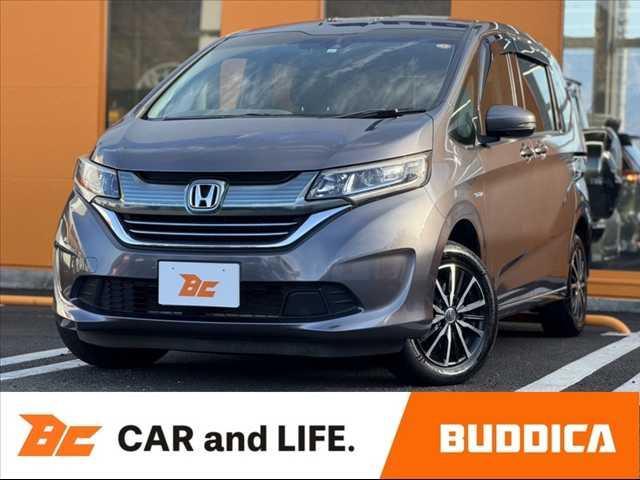 フリードハイブリッド(ホンダ) ハイブリッド・Ｇホンダセンシング　禁煙車　ホンダセンシング　両電スラ　インターナビセット　Ｂカメラ　フルセグ　ＬＥＤヘッド　　シートヒーター　２列目キャプテンシート　ロールサンシェード　スマートキー　ＥＴＣ　ドラレコ　外１５ＡＷ 中古車画像