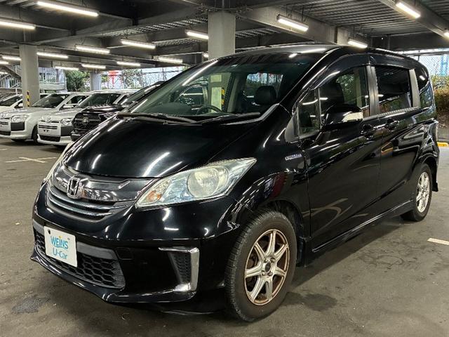 フリードハイブリッド(ホンダ) ハイブリッド プレミアムエディション Rカメ 横滑り防止 地デジフルセグ 両側電動SD DVD オートクルーズコントロール キーフリー スマートキーシステム エアコン パワーウィンドウ ABS ナビ&TV メモリーナビ アルミホイール 中古車画像