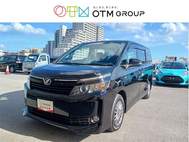 沖縄県の中古車ならヴォクシー ハイブリッドＶ　フルセグ　メモリーナビ　ＤＶＤ再生　ミュージックプレイヤー接続可　バックカメラ　ＥＴＣ　両側電動スライド　ＬＥＤヘッドランプ　乗車定員７人　３列シート　記録簿