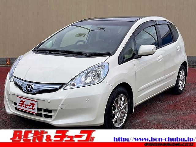 フィットハイブリッド ナビプレミアムセレクション ハイブリッドナビプレミアムセレクション スカイルーフ ETC HIDヘッドライト 前後シートヒーター パドルシフト 横滑り防止機能 DVD パーキングセンサー ステアリングリモコン クルコン(1枚目)