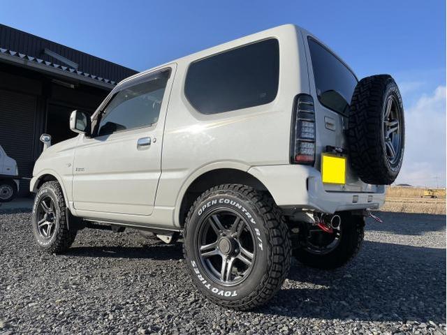 スズキ JB23 ジムニー　ショウワガレージ製フロント・リヤバンパー交換　マフラー交換　スペアタイヤ移設キット取付　ナンバープレート（ナンバー灯）移設キット取付　タニグチ製牽引フック取付