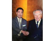 会長 安野　甚次　（写真左）